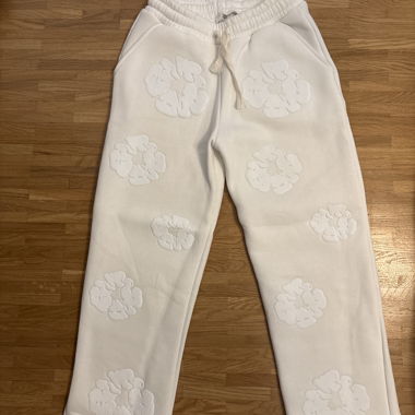 Beige floral trousers