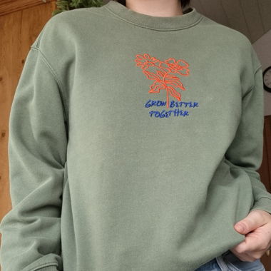 green sweater with print 