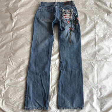 Lower waisted embroidered pinstripe bootcut jeans