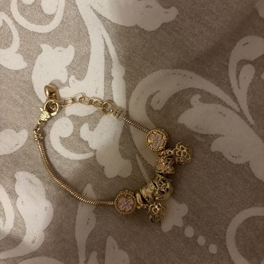 Bracciale charm dorato