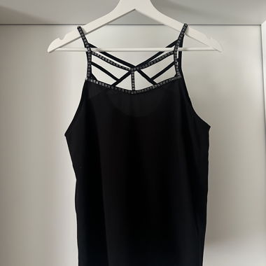 Black camisole with decorative straps
