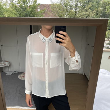 Thin creamy shirt with silver crystals at collar