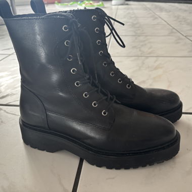 Black lace-up combat boots