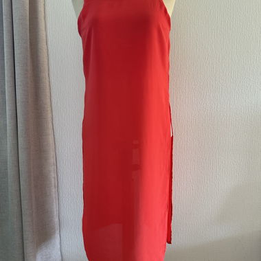 Red sleeveless top with slit in the back and side