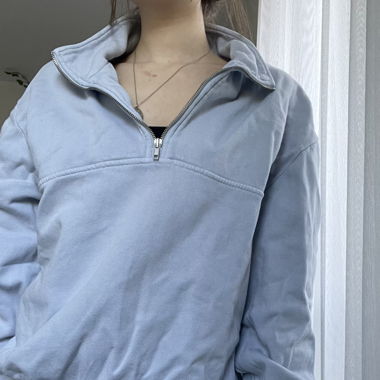 blue zip-up sweatshirt