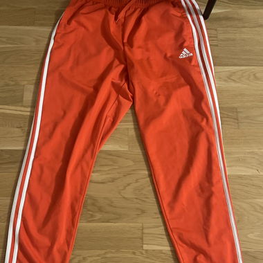 Red Adidas jogging pants