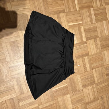 Jupe plissée noire courte