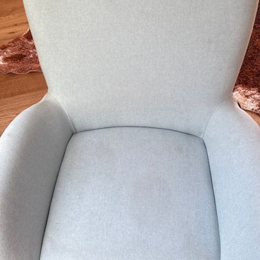 Grey upholstered armchair