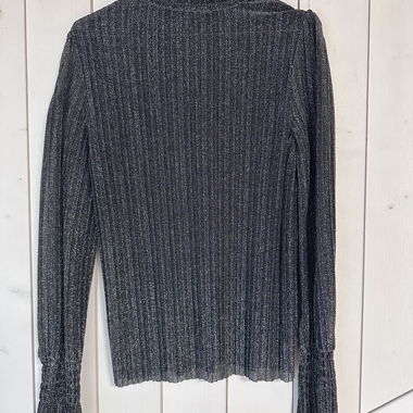 Blusa con glitter e collo alto
