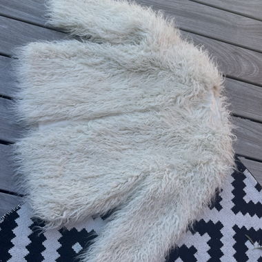 Veste en fausse fourrure blanche
