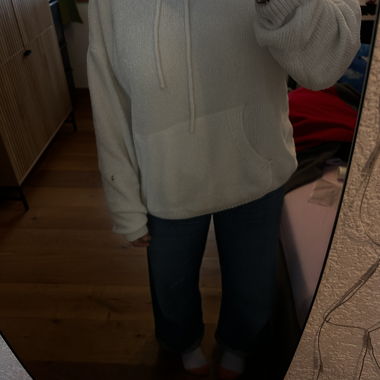 White hooded sweatshirt.