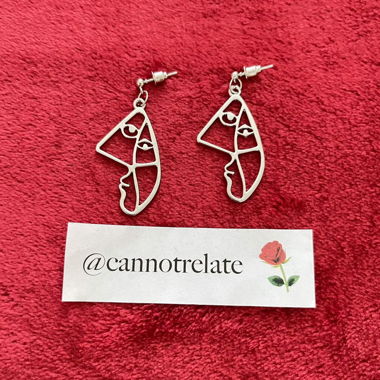 Boucles d'oreilles visage abstrait en contour