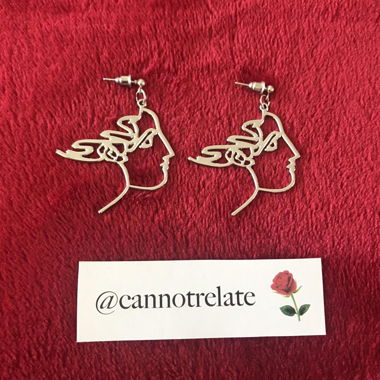 Boucles d'oreilles visage abstrait en contour