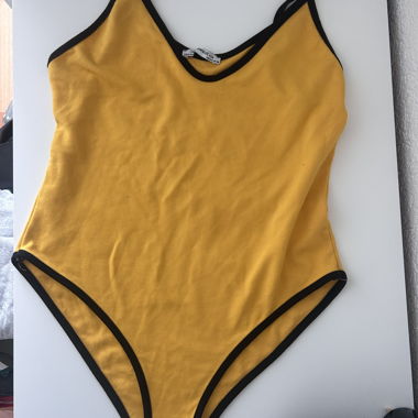 Yellow bodysuit with black trim