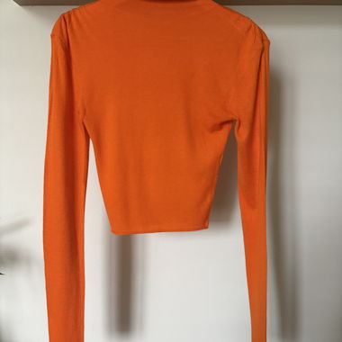 Top arancione aderente a maniche lunghe