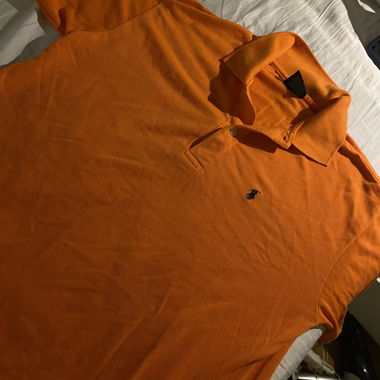 Polo Lacoste arancione