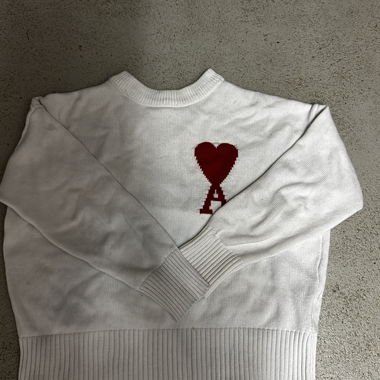 White Ami sweater with red heart logo