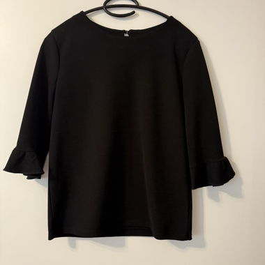 Blusa con maniche a tromba