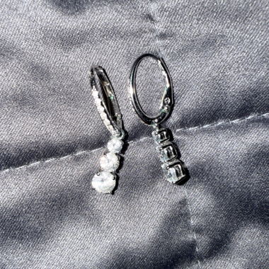 Silver-coloured Swarovski drop earrings with stones
