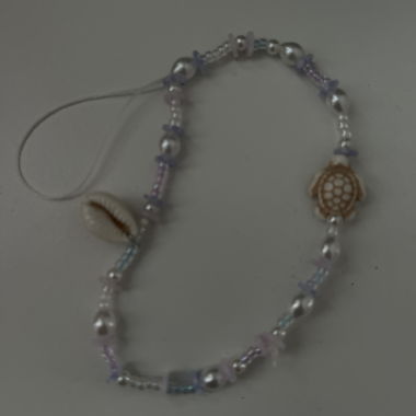 Bracciale con perle e conchiglie