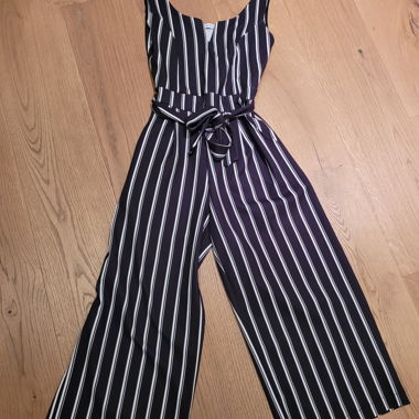 Sleeveless jumpsuit with tie belt