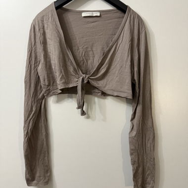 Maglia marrone a maniche lunghe