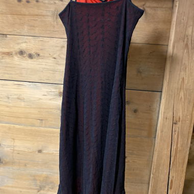 Black midi dress with red slip