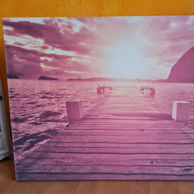 Leinwandbild mit Brücke am Meer