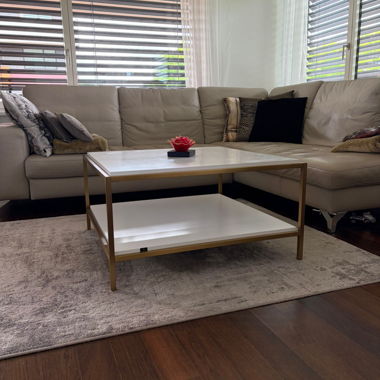 White coffee table with golden frame