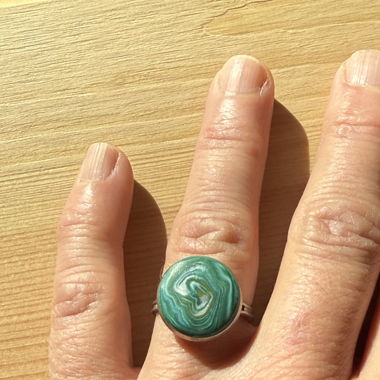 Ring with green polymer stone