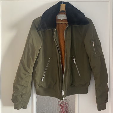 Dark military-green bomber with faux fur collar