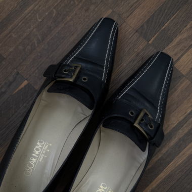 Black leather heels with a belt strap 