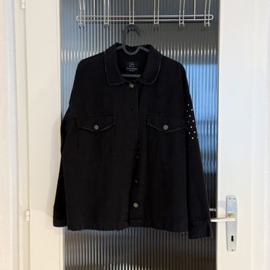 Washed black denim jacket with rhinestones