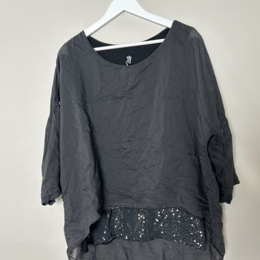 Blusa nera trasparente con paillettes