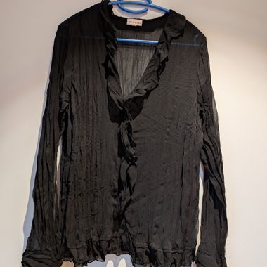 Blusa nera con rouches di Biaggini