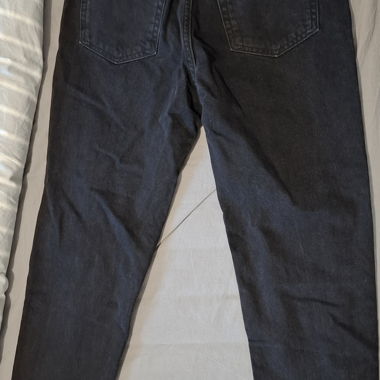 Black ripped jeans, straight cut