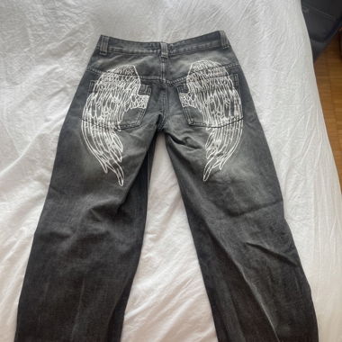 Jeans low rise con stampa ali