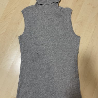 Sleeveless top with roll neck