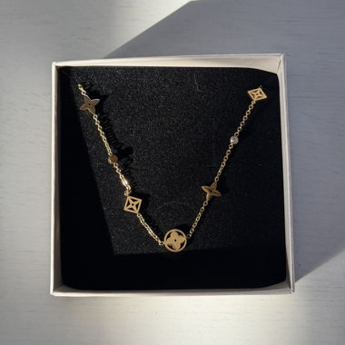 Gold-colored chain with pendants