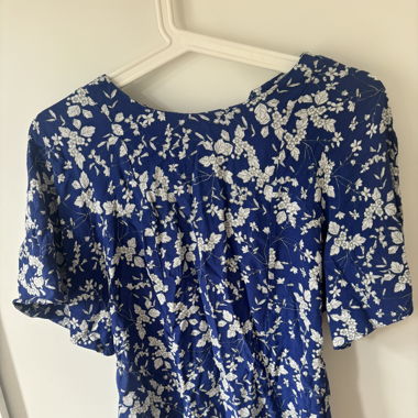 blue top with floral print 