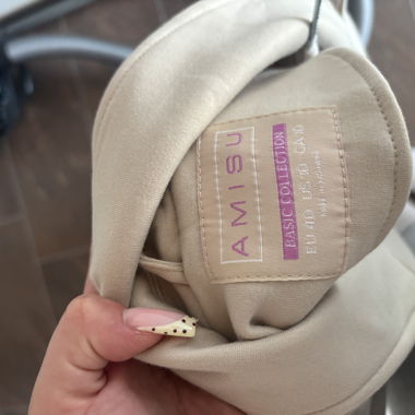 Beige women's coat with tie belt