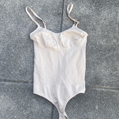 Beige spaghetti-strap bodysuit