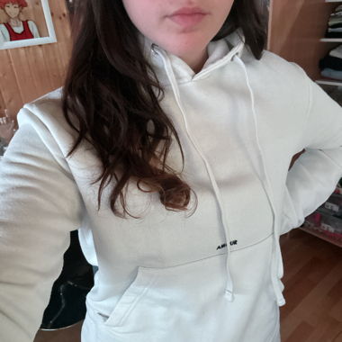 White hoodie with the word love on it
