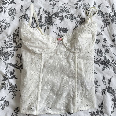 White eyelet corset with little pink bow