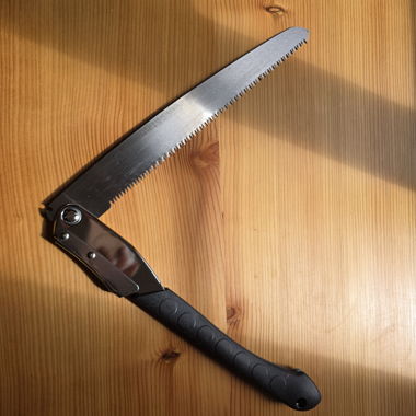 Folding saw with plastic handle