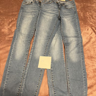 Two pairs of identical trousers for sale