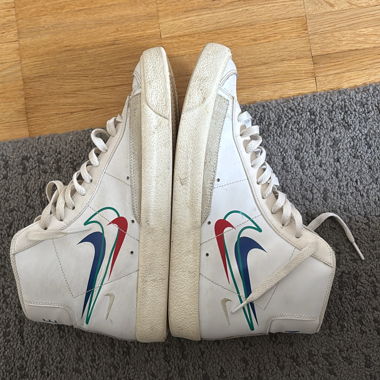 Vintage white high-top Nike sneakers