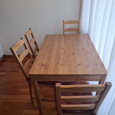 Table and 4 chairs with covers