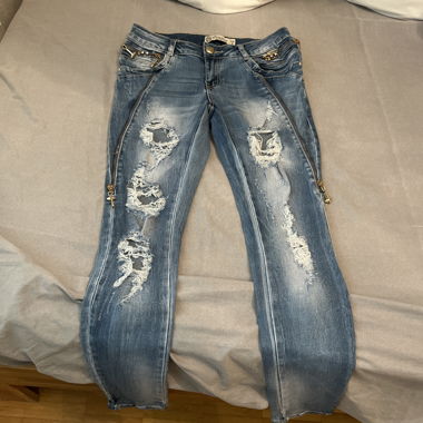 Jeans skinny strappati blu a vita bassa