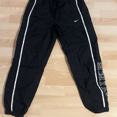 Pantaloni da allenamento NIKE neri con bianco
